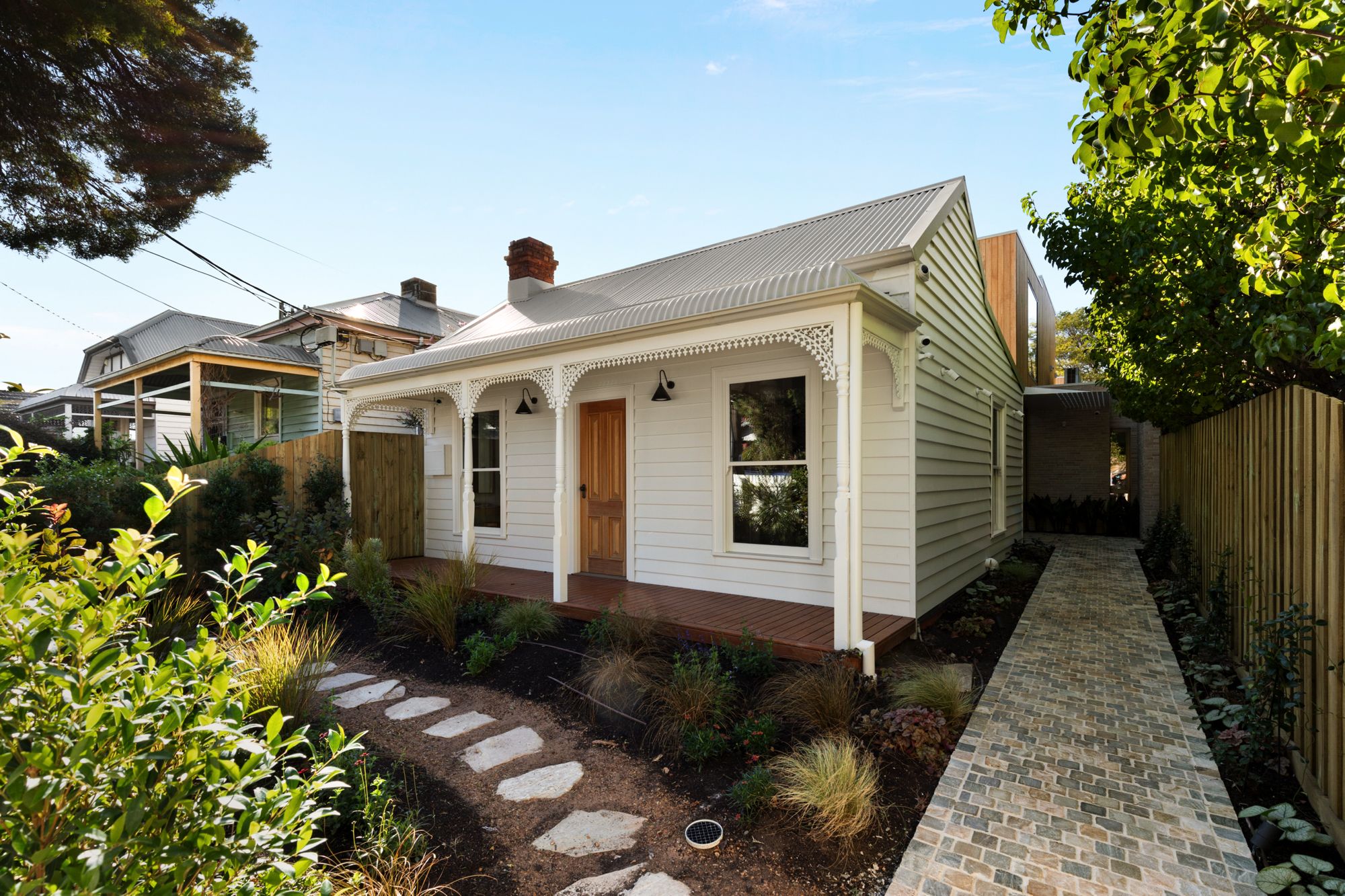 Balston from the street: a weatherboard Victorian with a fretwork verandah and garden path